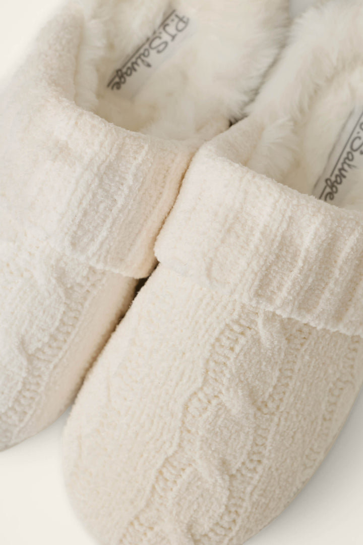 Close-up of the P.J. Salvage Cozy Chenille Cable Knit Ivory Slippers, featuring a cable-knit design and fluffy white lining.