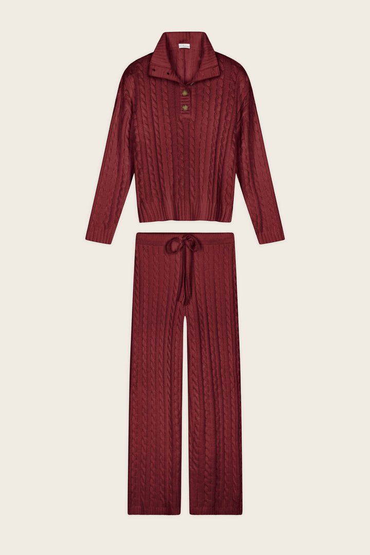 The Cozy Chenille Cable Knit Dark Wine Pullover Lounge Set by P.J. Salvage features a matching cable knit design, including a long-sleeve pullover top with button-up collar and wide-leg drawstring pants.