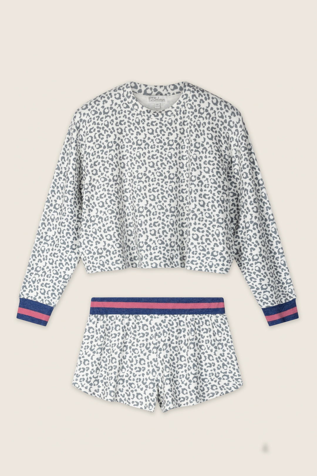The Cat’s Meow Big Stretch Short PJ Set by P.J. Salvage features a peachy-soft grey leopard print, including a long-sleeve white top and matching shorts with navy and pink striped accents, shown flat on a light beige background.