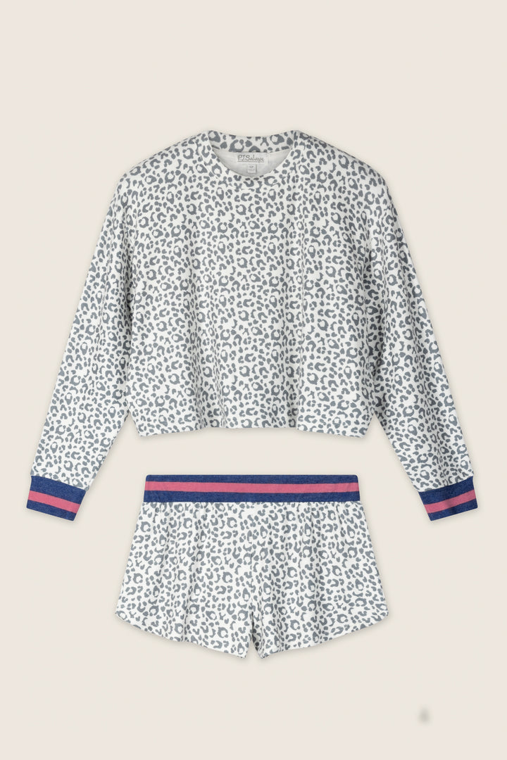 The Cat’s Meow Big Stretch Short PJ Set by P.J. Salvage features a peachy-soft grey leopard print, including a long-sleeve white top and matching shorts with navy and pink striped accents, shown flat on a light beige background.