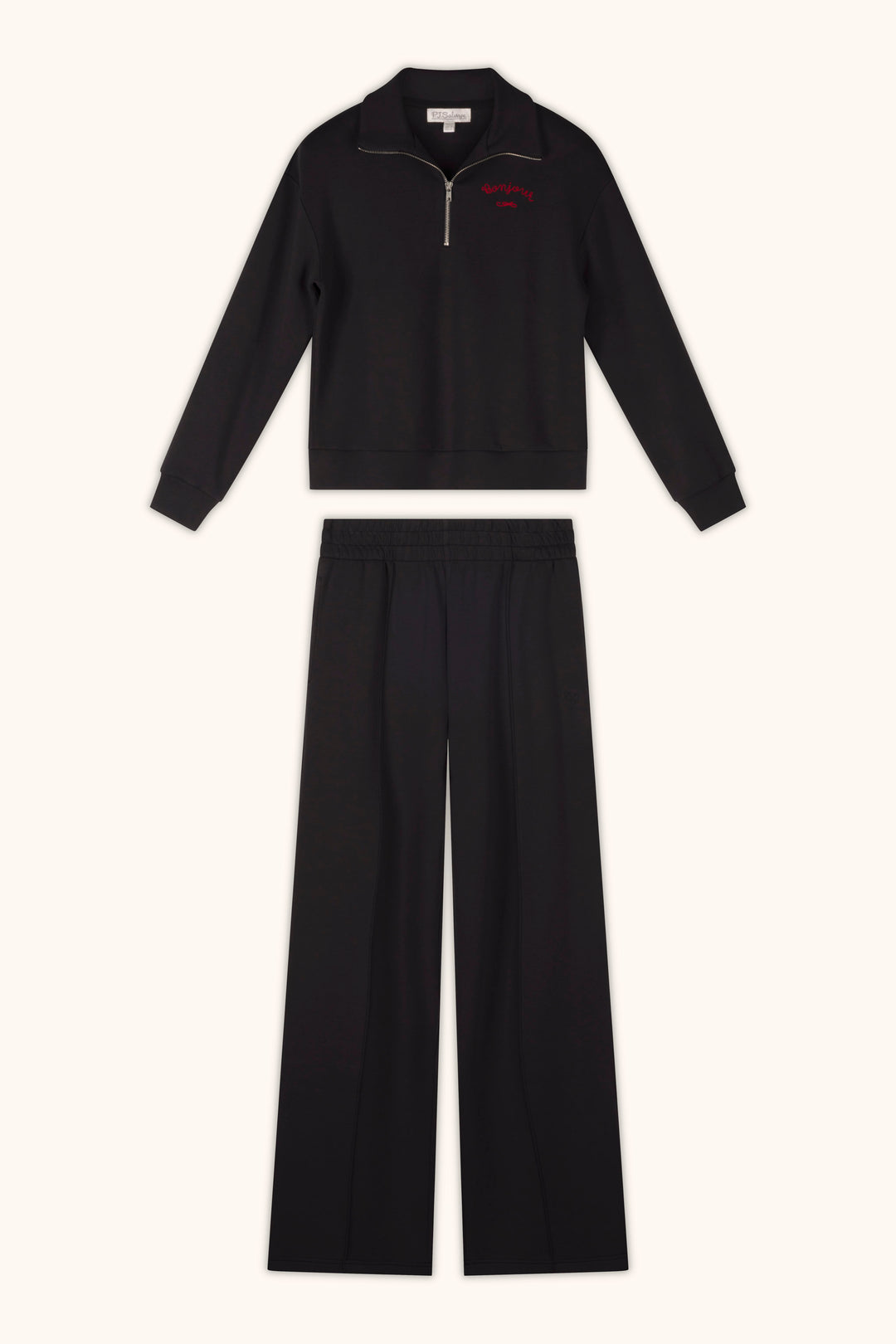 A pair of P.J. Salvage C'est La Vie Midnight Flights Runway Pants, styled with a zip-up long sleeve top, is laid flat on a light background.