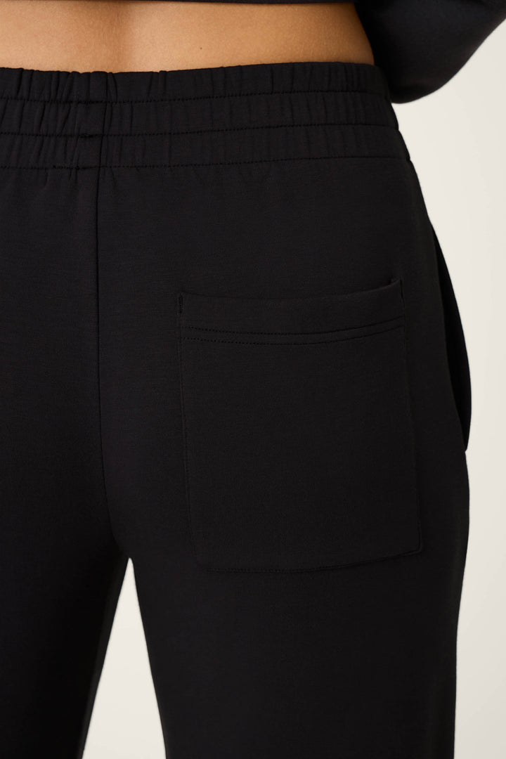 Close-up of the left back pocket and waistband of the P.J. Salvage C'est La Vie Midnight Flights Runway Pants, highlighting the visible seam and elastic waistband. The soft, comfortable fabric is clearly shown in this detail shot.