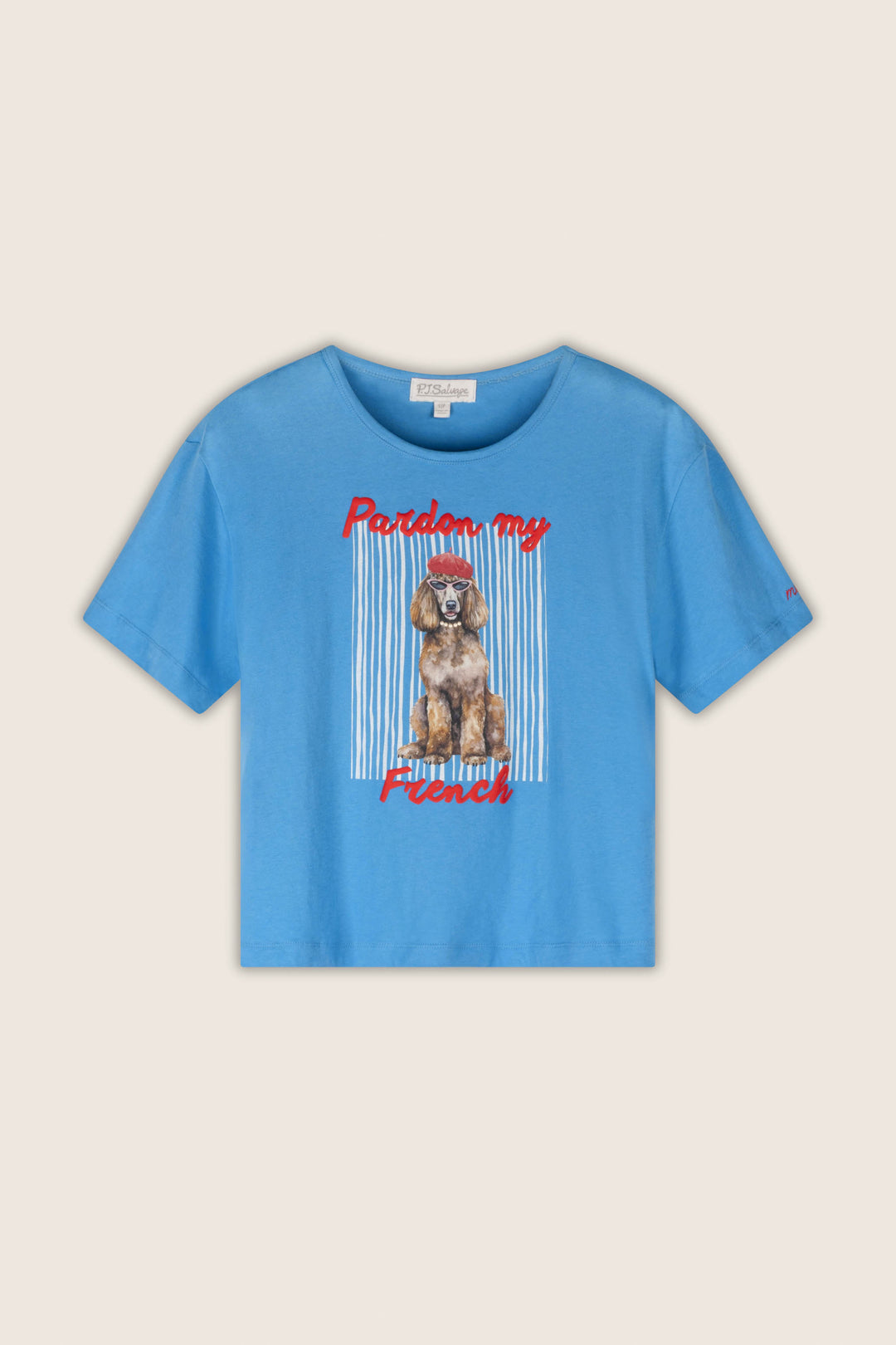 A light blue short-sleeve t-shirt with a graphic of a French Poodle wearing a red bow, framed by vertical white stripes, with the red text 'Pardon my French' on a light beige background.