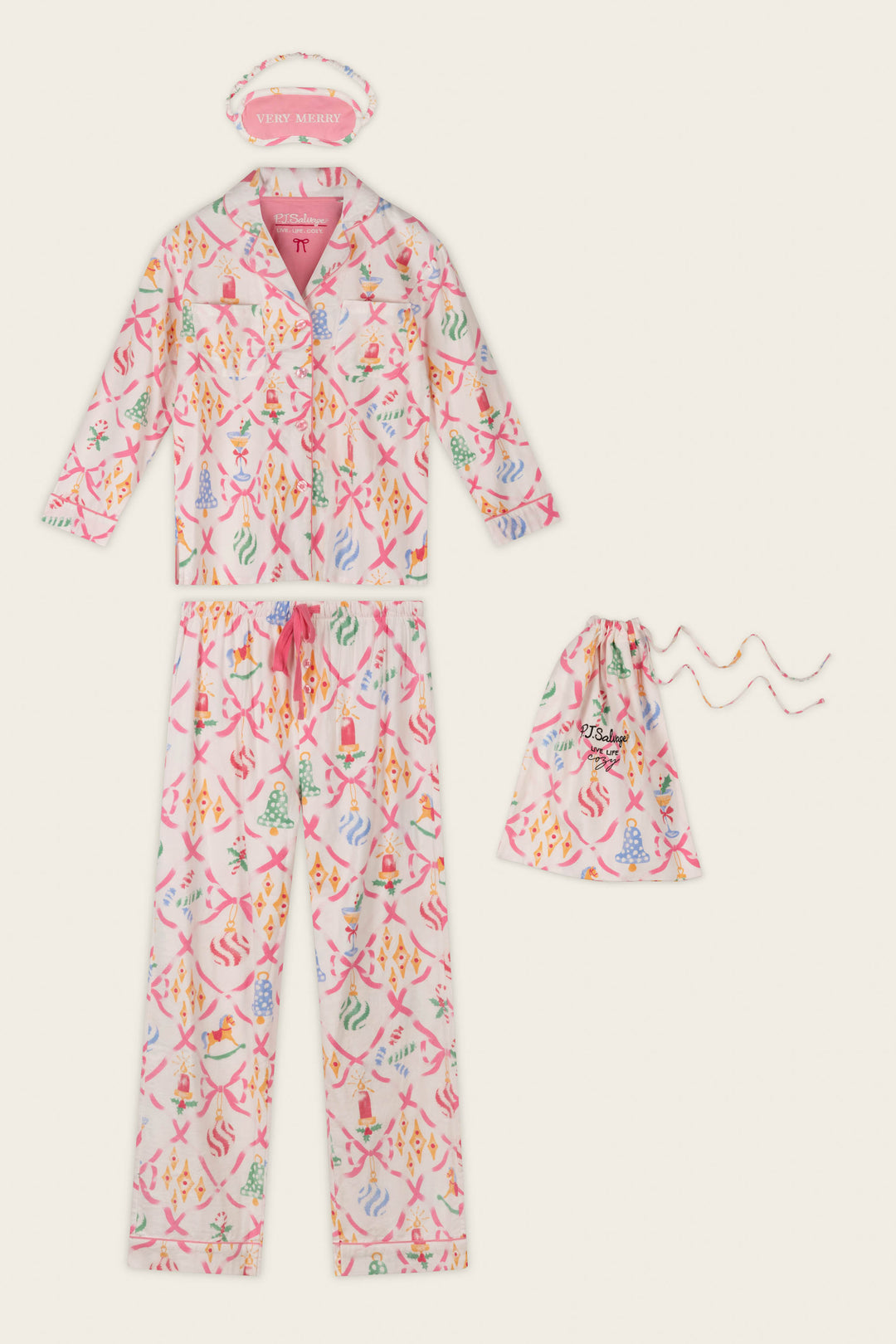 The P.J. Salvage Deck the Halls Ornament Print 4-Piece PJ Set features a colorful, patterned button-up top and pajama pants, a coordinating drawstring pouch, and a pink sleep mask embroidered with “VERY MERRY,” all displayed flat on a light background.