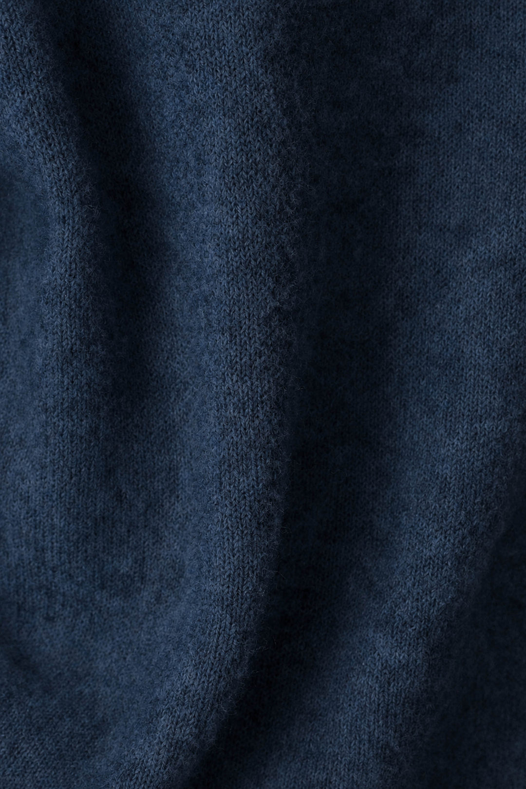 Close-up of the You Are My Lucky Star Snuggle Sweater by P.J. Salvage in dark blue, highlighting its soft, fuzzy knit texture and gentle folds.