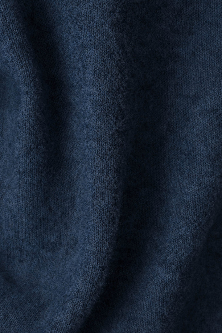 Close-up of the You Are My Lucky Star Snuggle Sweater by P.J. Salvage in dark blue, highlighting its soft, fuzzy knit texture and gentle folds.