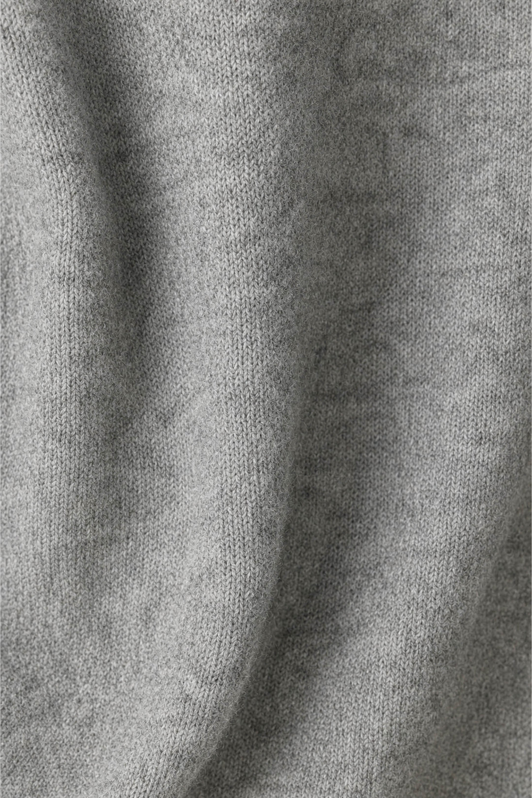 Close-up of the P.J. Salvage The Cocktail Club Snuggle Sweater in gray, featuring its knitted fabric with visible texture and soft folds.