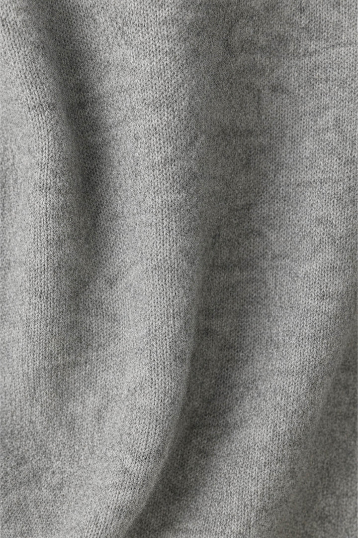 Close-up of the P.J. Salvage The Cocktail Club Snuggle Sweater in gray, featuring its knitted fabric with visible texture and soft folds.