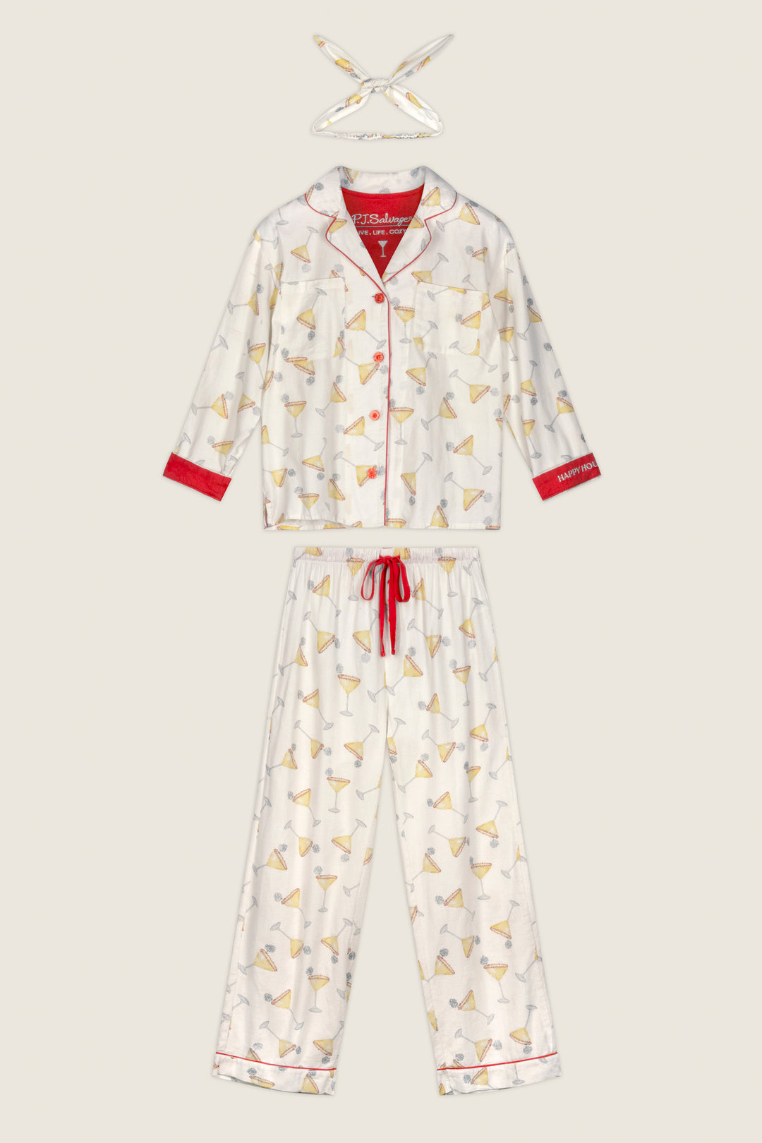 The P.J. Salvage Happy Hour Cocktail Print 3-Piece Flannel PJ Set features a white long-sleeve top, pants, and matching headband, each adorned with a playful martini glass print, red piping accents, and a coordinating red drawstring. The entire set is displayed flat against a light background.