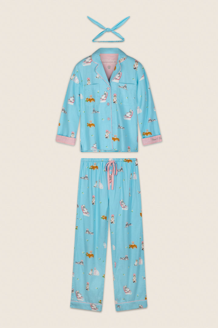 Slip into the cozy P.J. Salvage Pampered Cat Print 3-Piece Long Sleeve Flannel PJ Set, featuring a light blue pajama top and pants adorned with playful cat prints, pink trim on the cuffs, and a matching pink and blue tie headband.