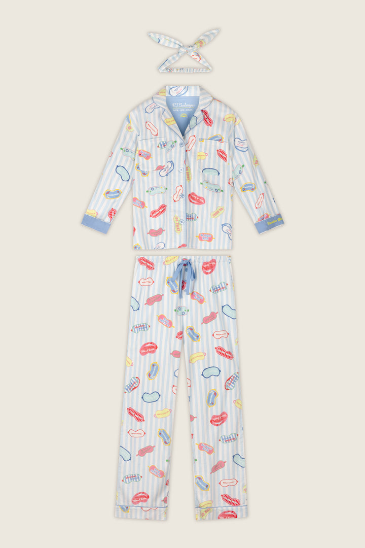 The P.J. Salvage Out of Office Eyemask Print 3-Piece Flannel PJ Set includes a light blue, long-sleeve, button-up pajama top and matching bottoms featuring playful prints of lipstick, lips, and other makeup items on a white-striped background, complete with a coordinating headband.