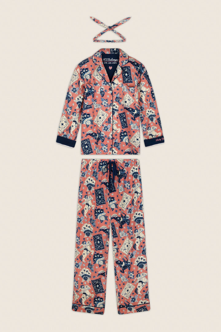 The P.J. Salvage Lucky in Love Western Print 3-Piece Long Sleeve Flannel PJ Set, featuring a colorful cat and floral print on a pink background, is displayed flat against a neutral surface with its matching headband.