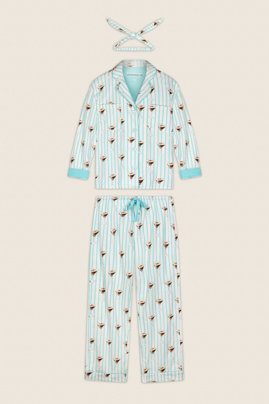 The P.J. Salvage Espresso Martini Print 3-Piece Long Sleeve Flannel PJ Set, featuring a button-up top, matching pants with a drawstring waist, and a coordinating headband, is displayed laid flat on a neutral background.