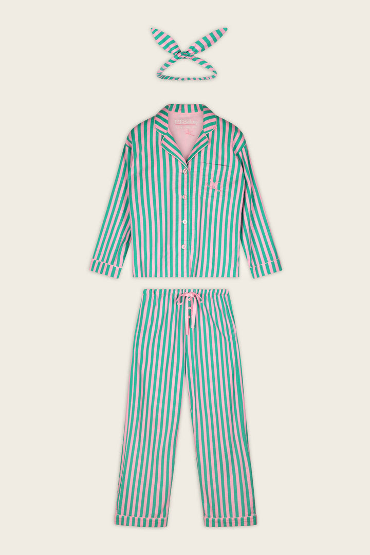 The P.J. Salvage Ski Bunny Icon 3-Piece Long Sleeve Flannel PJ Set includes a button-up long-sleeve top, matching drawstring pants, and a coordinating fabric headband. The set features vertical green, pink, and white stripes and is laid flat on a cream background.