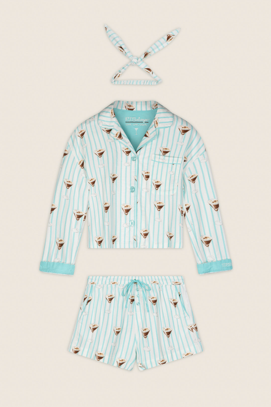 The Espresso Martini Print 3-Piece Flannel PJ Set by P.J. Salvage, featuring a long-sleeve shirt, drawstring shorts, and a matching headband with light blue and white stripes and coffee cup motifs, is laid flat on a cream background.