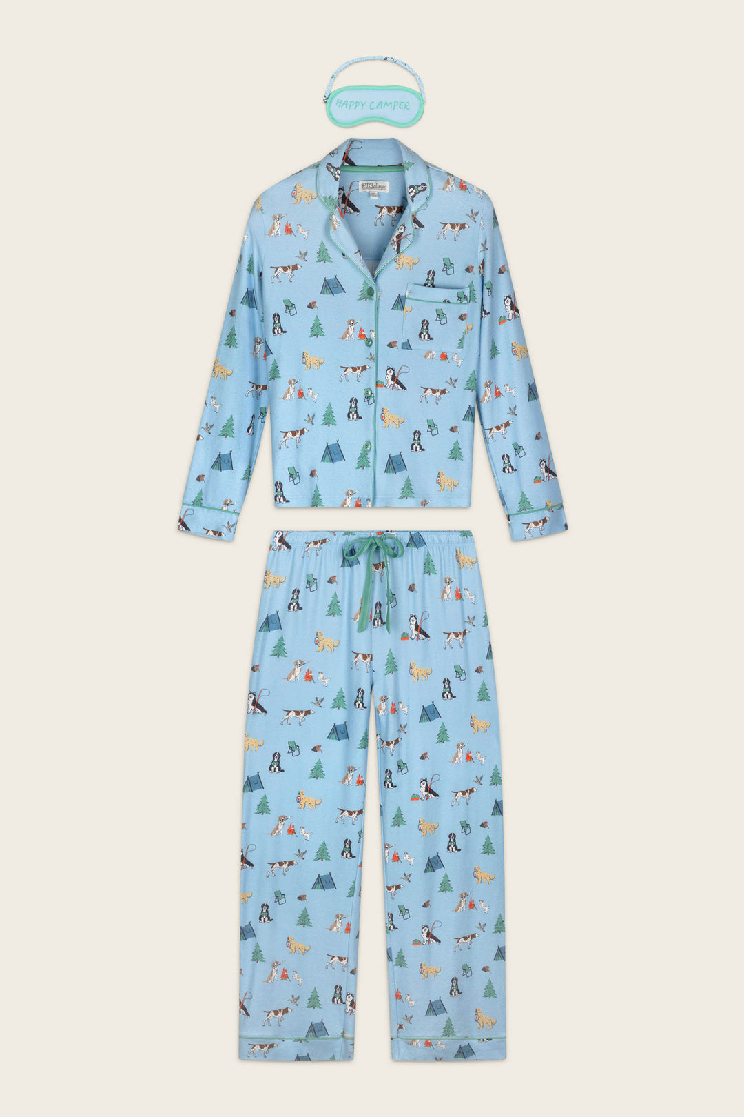 The Happy Campawr Dogs Camping Print 3-Piece PJ Set by P.J. Salvage features a light blue pajama set with long sleeves and pants, adorned with playful camping-themed prints such as tents, trees, animals, and campers. Displayed flat with a “Happy Camper” label above.
