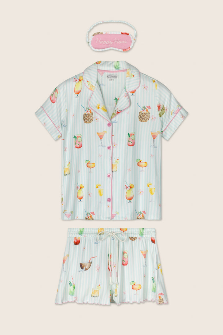 The P.J. Salvage It's Five O'clock Somewhere Cocktail Print 3-Piece PJ Set features a short-sleeve button-up top, shorts with tropical cocktail and fruit prints, plus a pink “Happy Hour” eye mask.