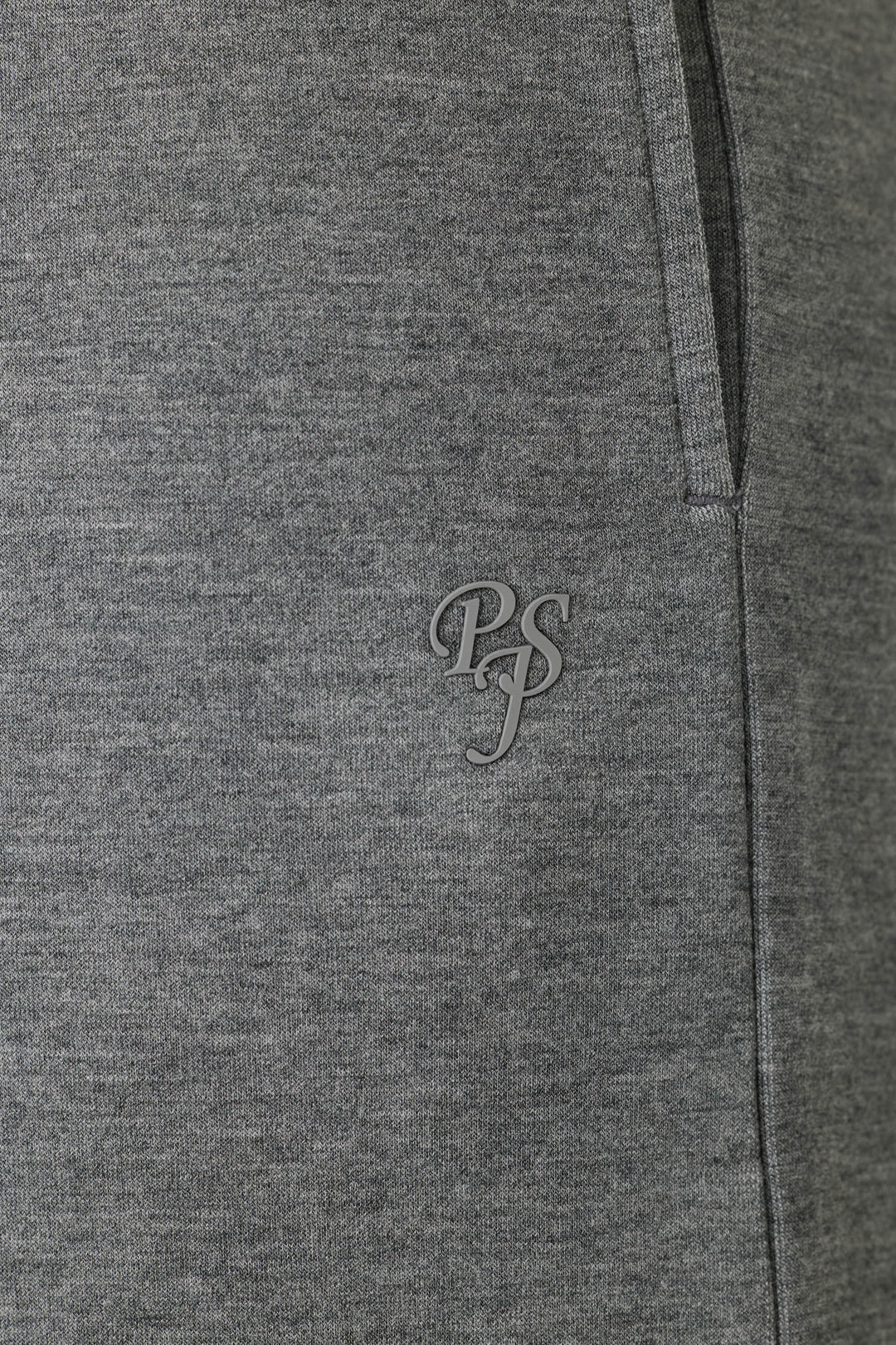 Close-up of the Nature Is My Therapy Runway Lounge Pants by P.J. Salvage, featuring soft, slightly textured grey fabric and a small P.J. Salvage logo printed near the pocket.