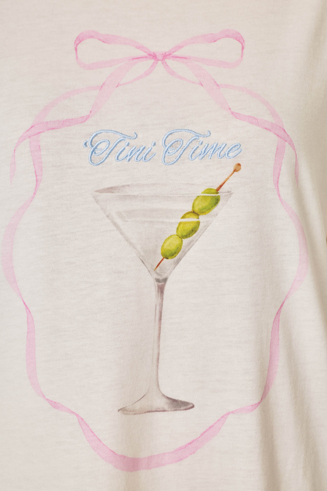 The Olive You Martini Print Nightshirt by P.J. Salvage features a drawing of a martini glass with three green olives on a stick, surrounded by a pink ribbon design and the words "Tini Time" written above in blue script.