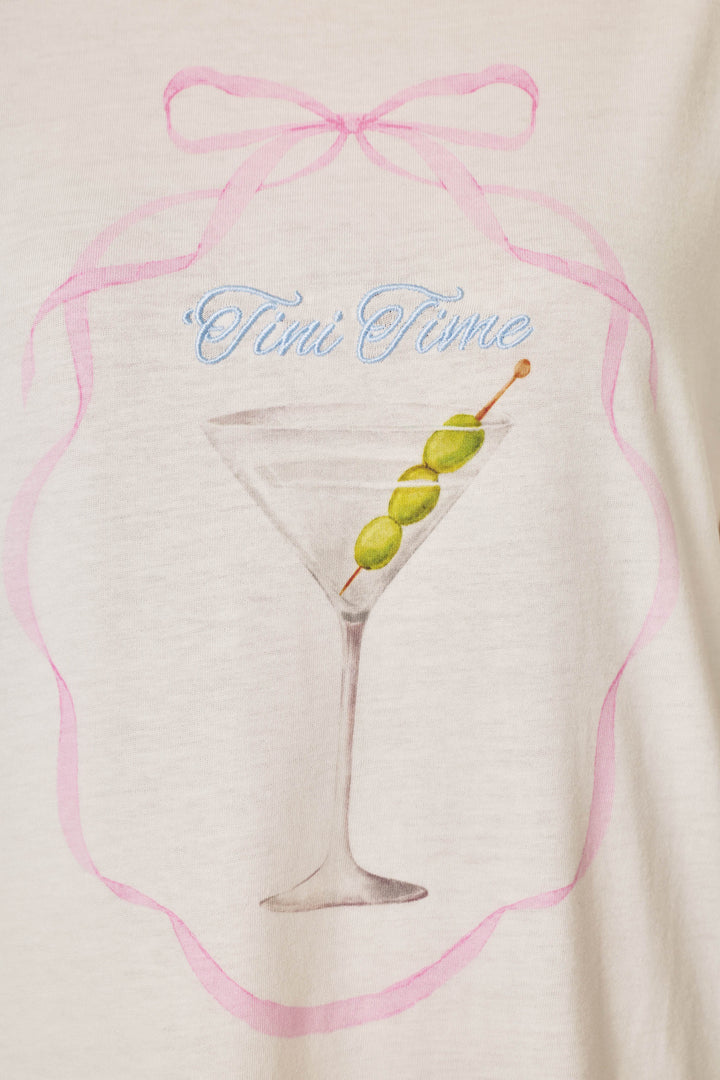 The Olive You Martini Print Nightshirt by P.J. Salvage features a drawing of a martini glass with three green olives on a stick, surrounded by a pink ribbon design and the words "Tini Time" written above in blue script.
