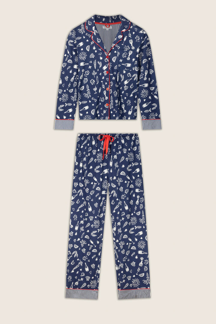 The Playful Prints Al Fresco Bistro Long PJ Set by P.J. Salvage features blue sleepwear with white illustrated patterns, red piping, a button-up top with chest pocket, and pants with red drawstring and striped cuffs.
