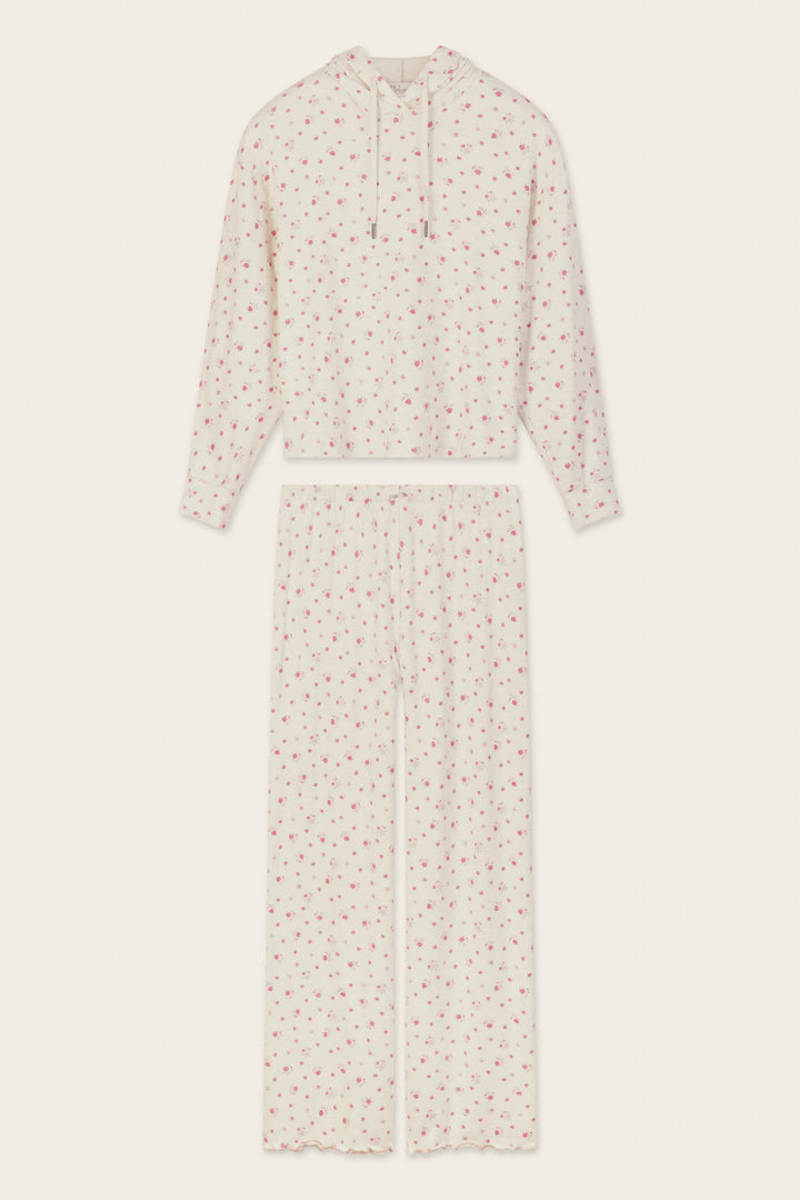The Romantic Rose Ditsy Rose Print Hoodie & Pants PJ Set by P.J. Salvage is a cream-colored pajama set with a hooded long-sleeve top and wide-leg pants, both adorned with a delicate pink floral print pattern. The set is displayed flat on a light background.