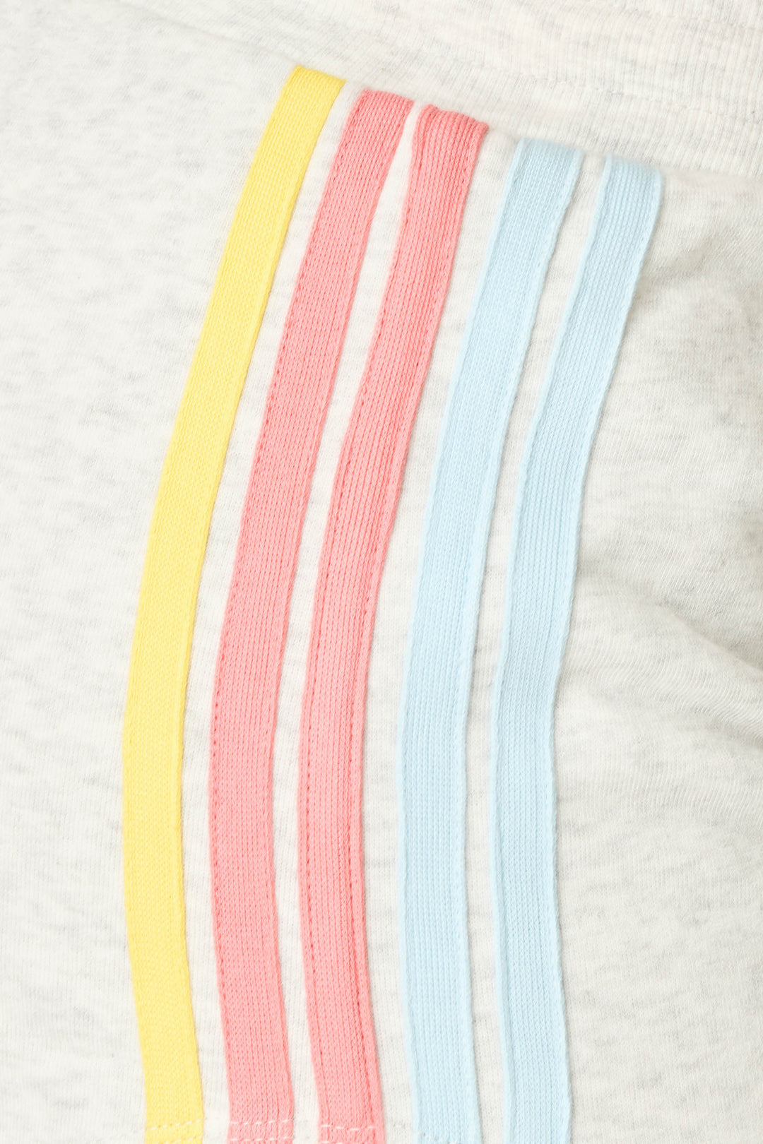 Close-up of the Sunday Funday Striped Shorts from P.J. Salvage, featuring light gray fabric with four parallel stripes in yellow, pink, and blue—a signature detail on these relaxed fit fleece shorts with a drawstring.
