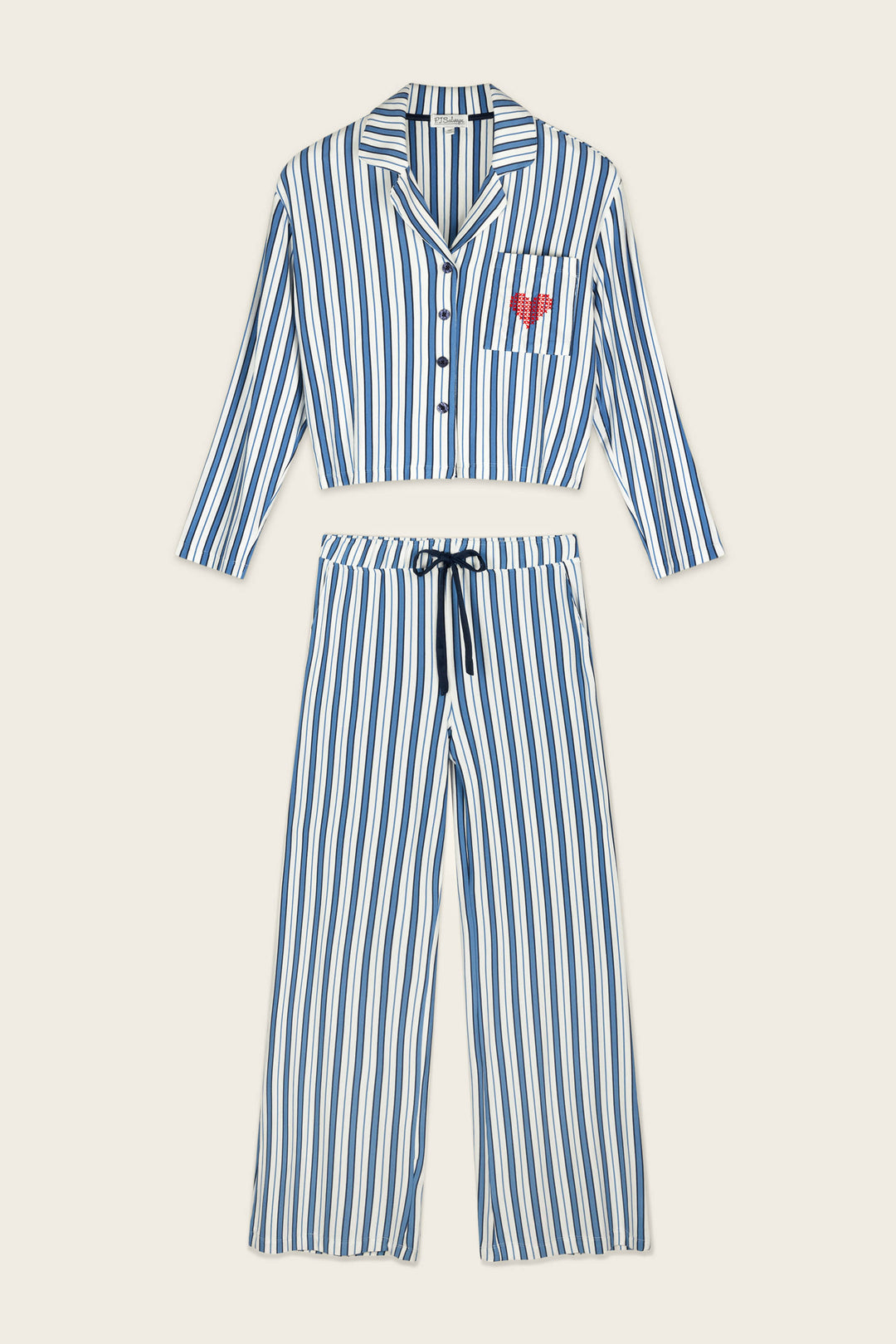 The Soiree Dreams Blue Stripe Long Sleeve PJ Set by P.J. Salvage features blue and white vertical stripes, a long-sleeve top with a red heart pocket detail on the left side, and matching pants with a drawstring waist.