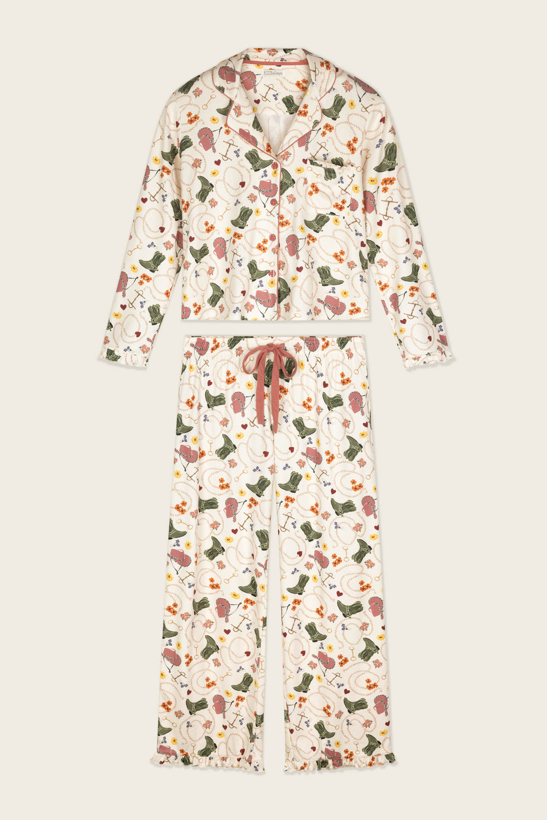 The Saddle Up Western Print Long Sleeve PJ Set by P.J. Salvage is a matching pajama set with a long-sleeve, button-up top and drawstring pants, featuring a western-inspired print.