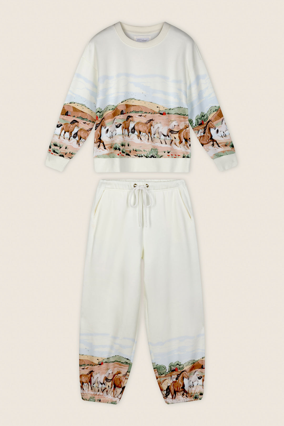 The P.J. Salvage Western Ways Untamed Spirit Frankie Sweatshirt is a cream-colored top featuring a printed landscape of wild horses, hills, and trees wrapping around the midsection.