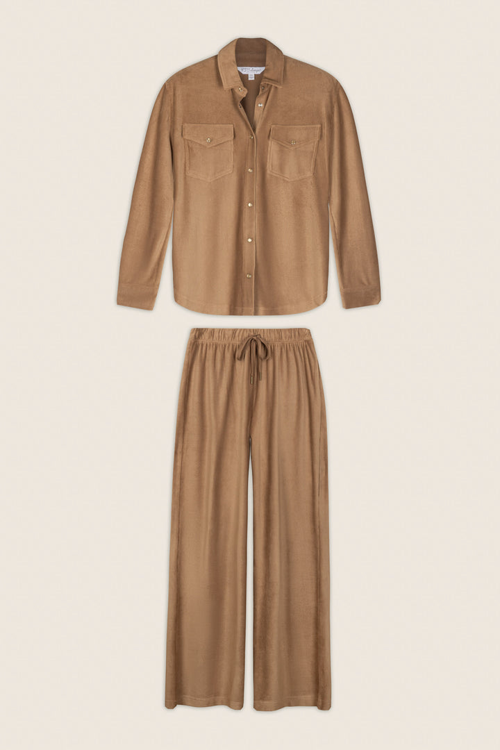 A matching set featuring the P.J. Salvage Western Ways Hey Cowboy Corduroy Knit Button Down Top—a light brown long-sleeve shirt with chest pockets—paired with wide-leg drawstring pants, laid flat on a beige background.