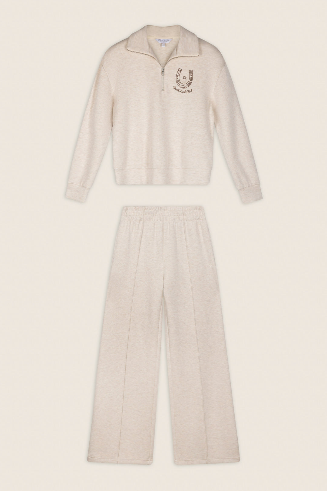 P.J. Salvage Western Ways Good Luck Club Over Night Pullover in beige, a long-sleeve zip-up top with a horseshoe emblem on the chest, paired with matching loose-fit elastic waistband pants, displayed flat against a neutral background.