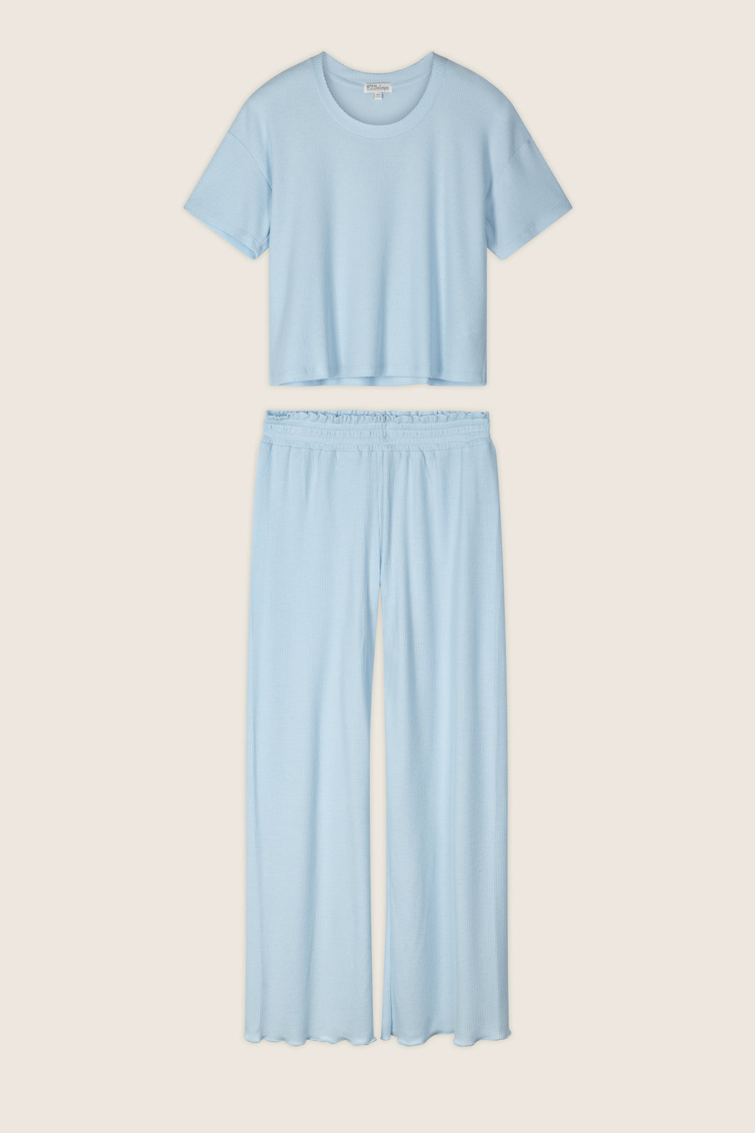 The P.J. Salvage Weekend Waffles Crystal Blue Long PJ Set includes a round-neck cropped top and wide-leg pants, shown flat on a neutral background—ideal for comfortable loungewear.