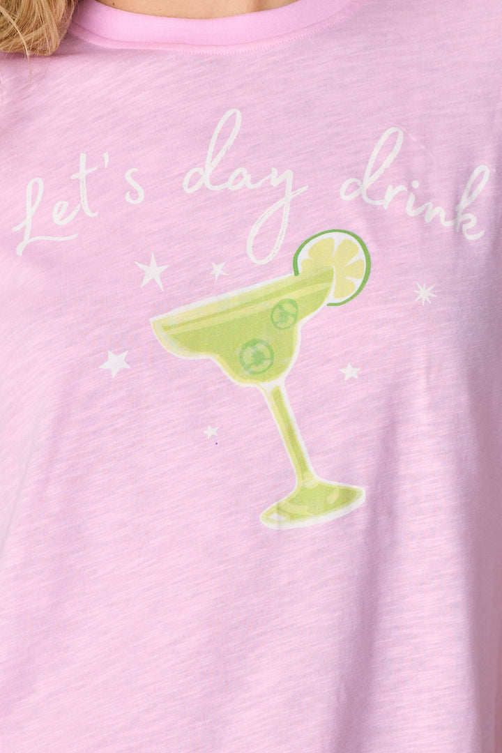 Close-up of the Softee "Let's Day Drink" Graphic Print Short PJ Set by P.J. Salvage, featuring a blush pink shirt with white script and a margarita glass—ideal for fans of fun, margarita-themed pajamas.