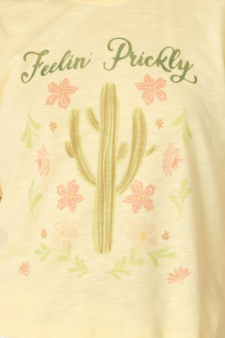The P.J. Salvage Softee "Feelin' Prickly" Graphic Print T-Shirt features a cactus with pink flowers and green leaves for a fun, vintage-inspired look.