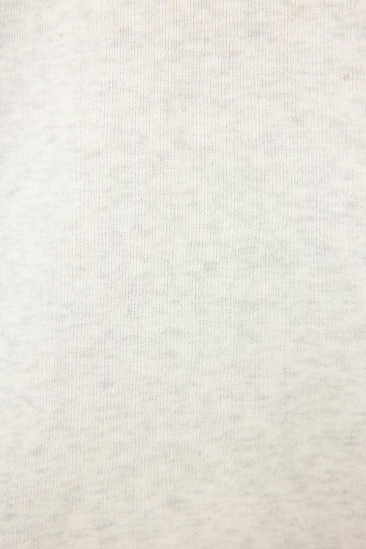 A close-up of the Sunday Funday Boucle "Sundays" Sweatshirt by P.J. Salvage highlights its soft, light grey heathered knit—showcasing a cozy textured fabric ideal for relaxed comfort.