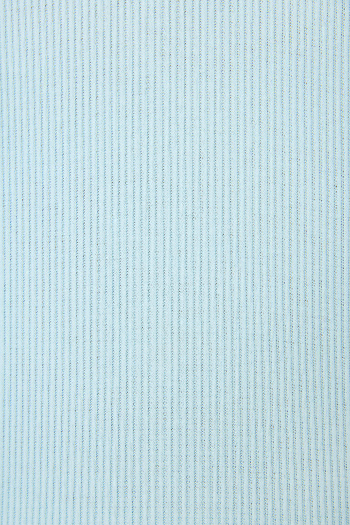 A close-up of a light blue ribbed knit fabric texture.