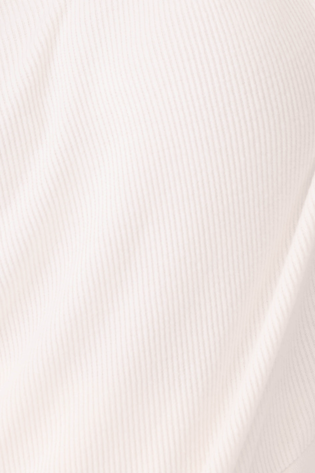 Close-up of the Textured Essentials Stone Lounge fabric by P.J. Salvage, featuring soft stone-colored rib jersey fabric with vertical lines and gentle folds.
