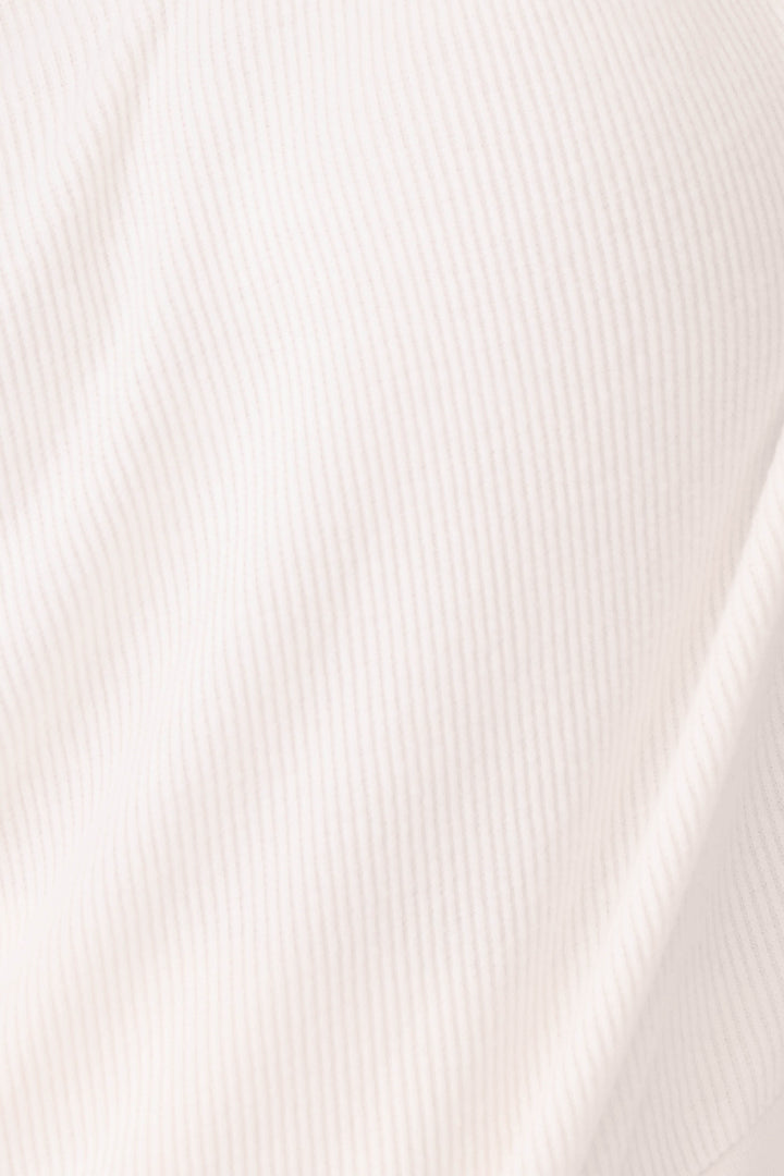 Close-up of the Textured Essentials Stone Lounge fabric by P.J. Salvage, featuring soft stone-colored rib jersey fabric with vertical lines and gentle folds.