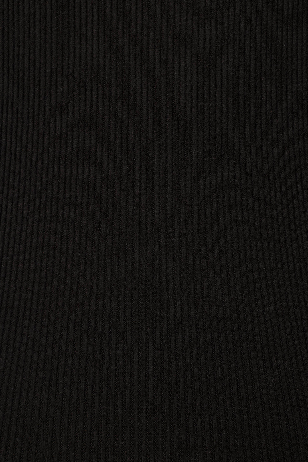 Close-up of the uniform black ribbed fabric featured in P.J. Salvage’s Textured Essentials Black PJ Set, ideal for cozy loungewear with vertical textured lines and an even finish.