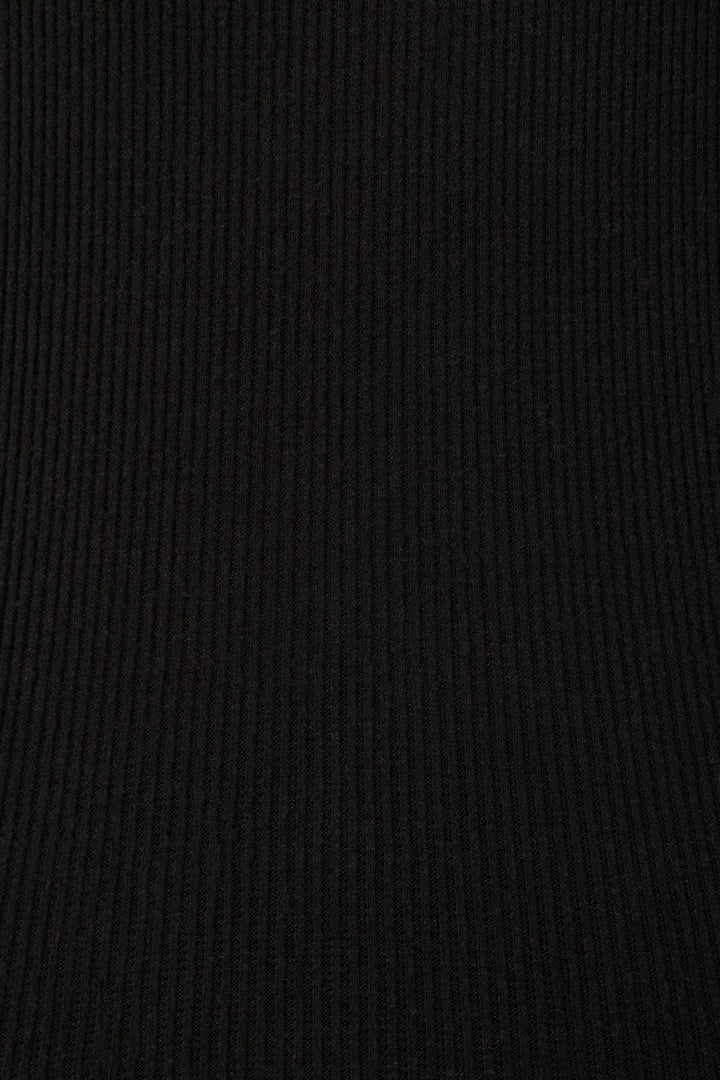 Close-up of the uniform black ribbed fabric featured in P.J. Salvage’s Textured Essentials Black PJ Set, ideal for cozy loungewear with vertical textured lines and an even finish.