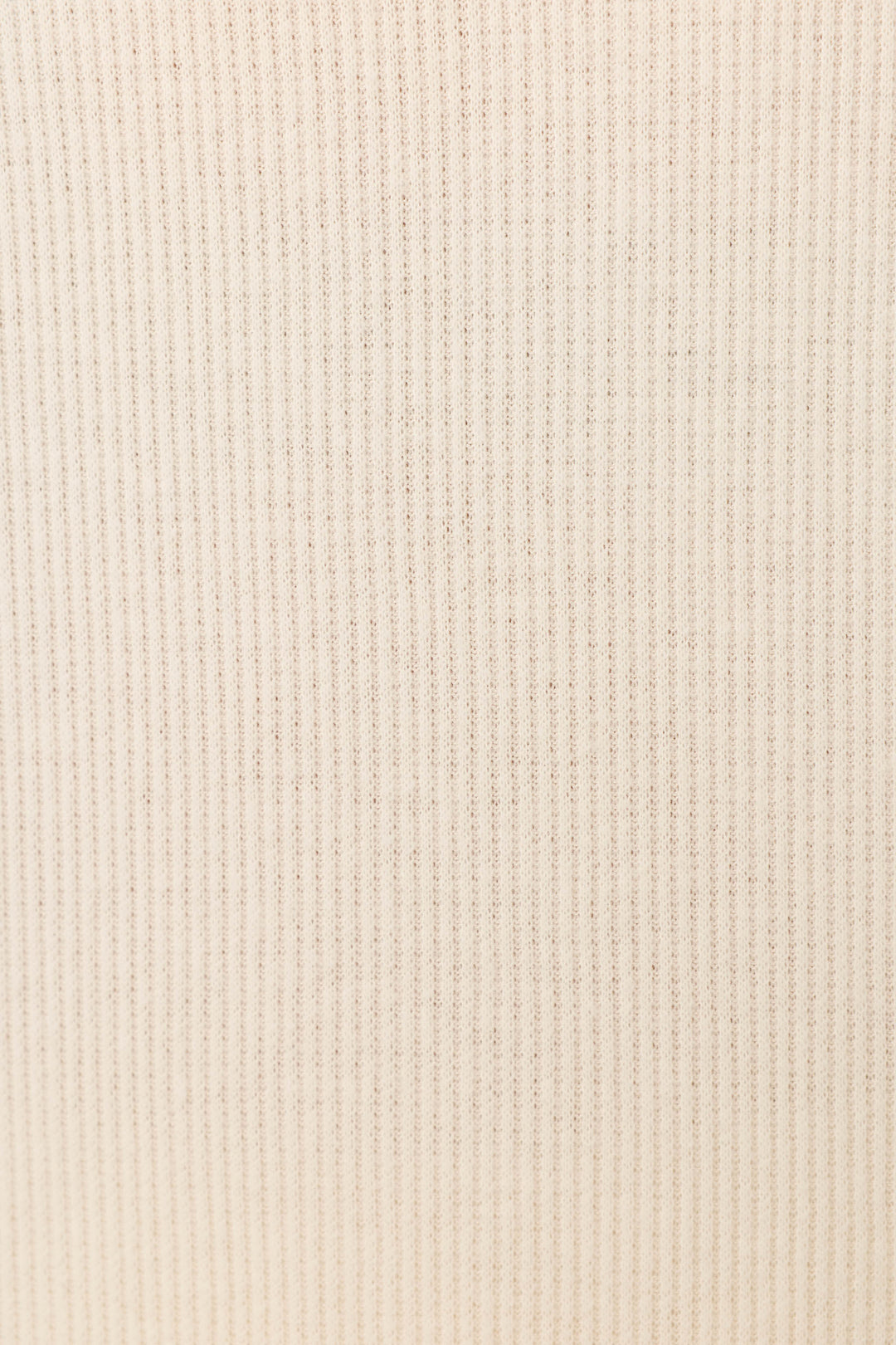 Close-up of the soft, beige rib knit fabric from P.J. Salvage's Textured Essentials Stone Long PJ Set, featuring evenly spaced vertical lines—ideal for cozy loungewear.