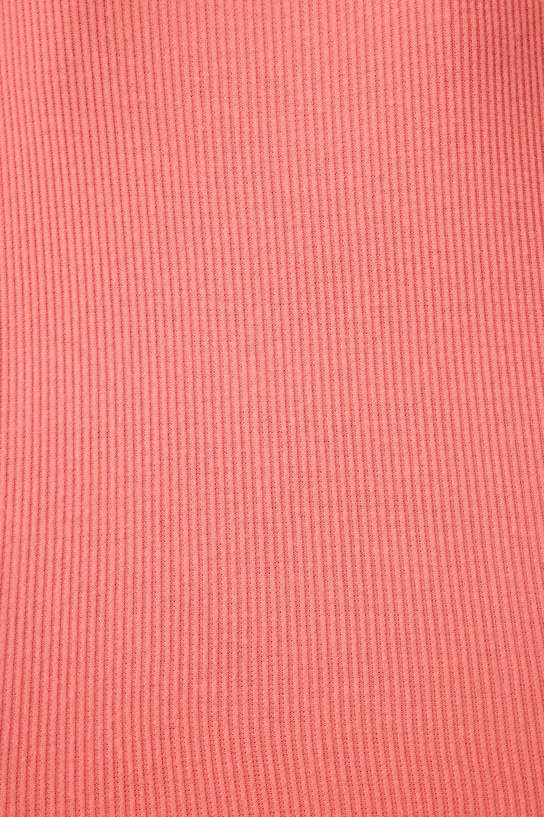 Close-up of the Textured Essentials Sunset Rose Long PJ Set by P.J. Salvage, featuring solid pink rib knit fabric with vertical lines and an even texture.