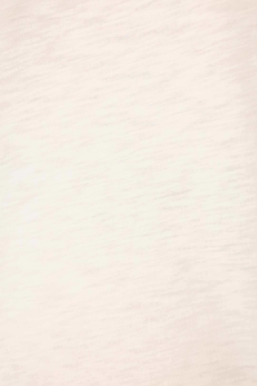 Light beige cotton-modal slub jersey fabric with a subtle, slightly textured pattern; smooth and evenly lit, no visible prints.