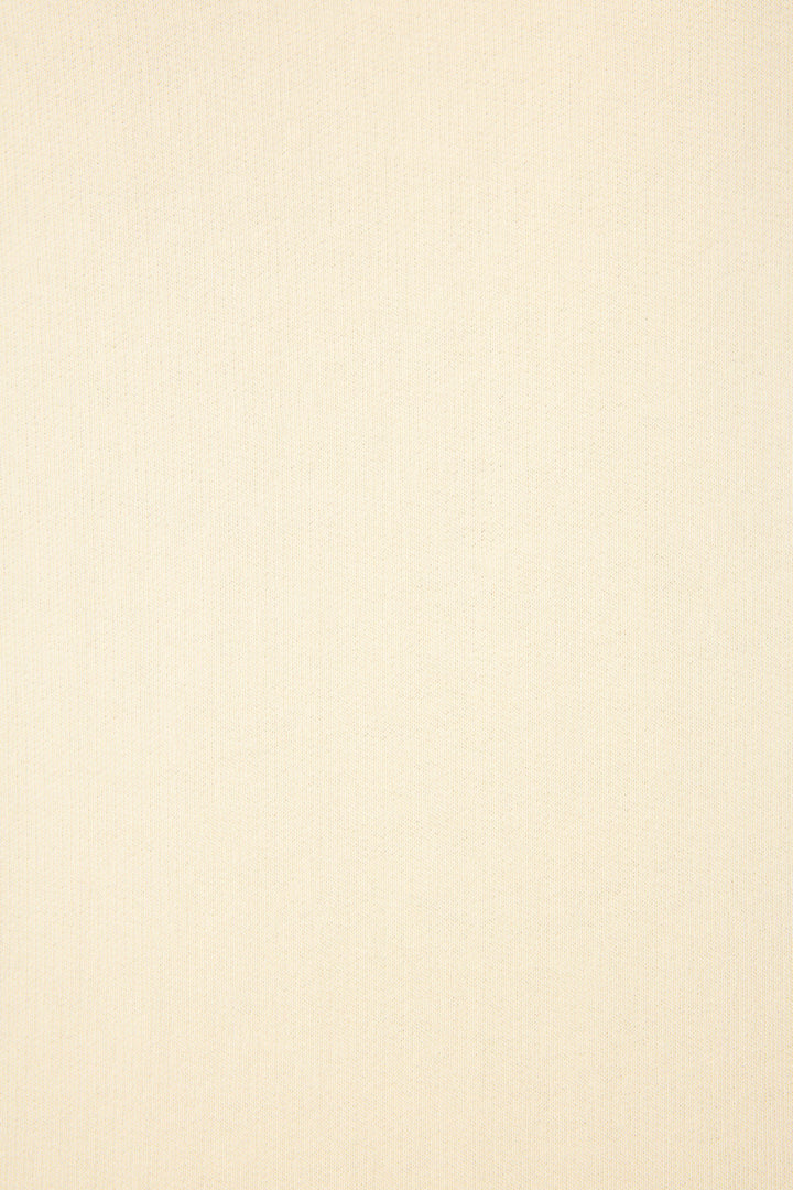 A soft, light beige textured surface fills the image, evoking the minimal and cozy style of P.J. Salvage’s Washed Away Lake Life For Life Long Lounge Set—simple and inviting with no distinct patterns.