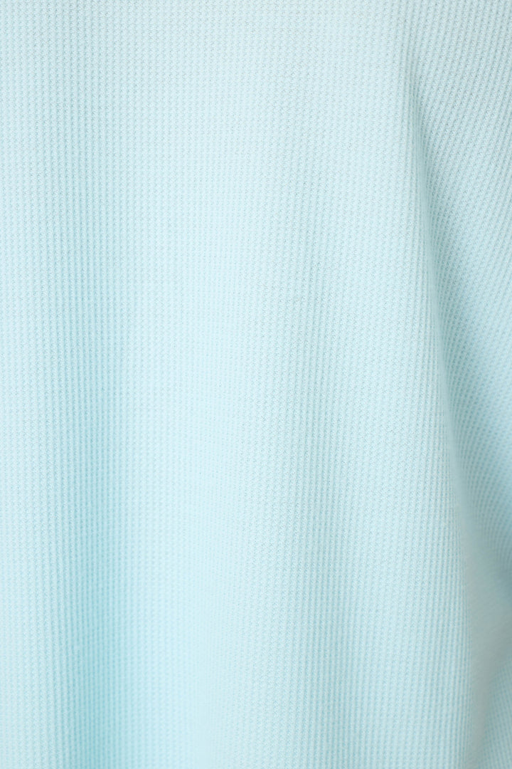 Close-up of P.J. Salvage Weekend Waffles Crystal Blue Sleep Shorts, crafted from ribbed fabric with vertical textured lines and gentle folds.