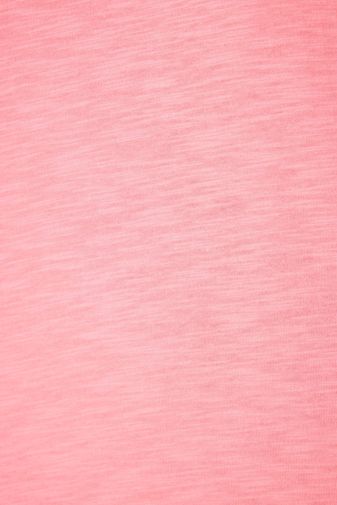A close-up of the Western Blooms Howdy Darlin Graphic Print T-Shirt by P.J. Salvage shows pink fabric with a subtle, heathered texture and soft color variations throughout.