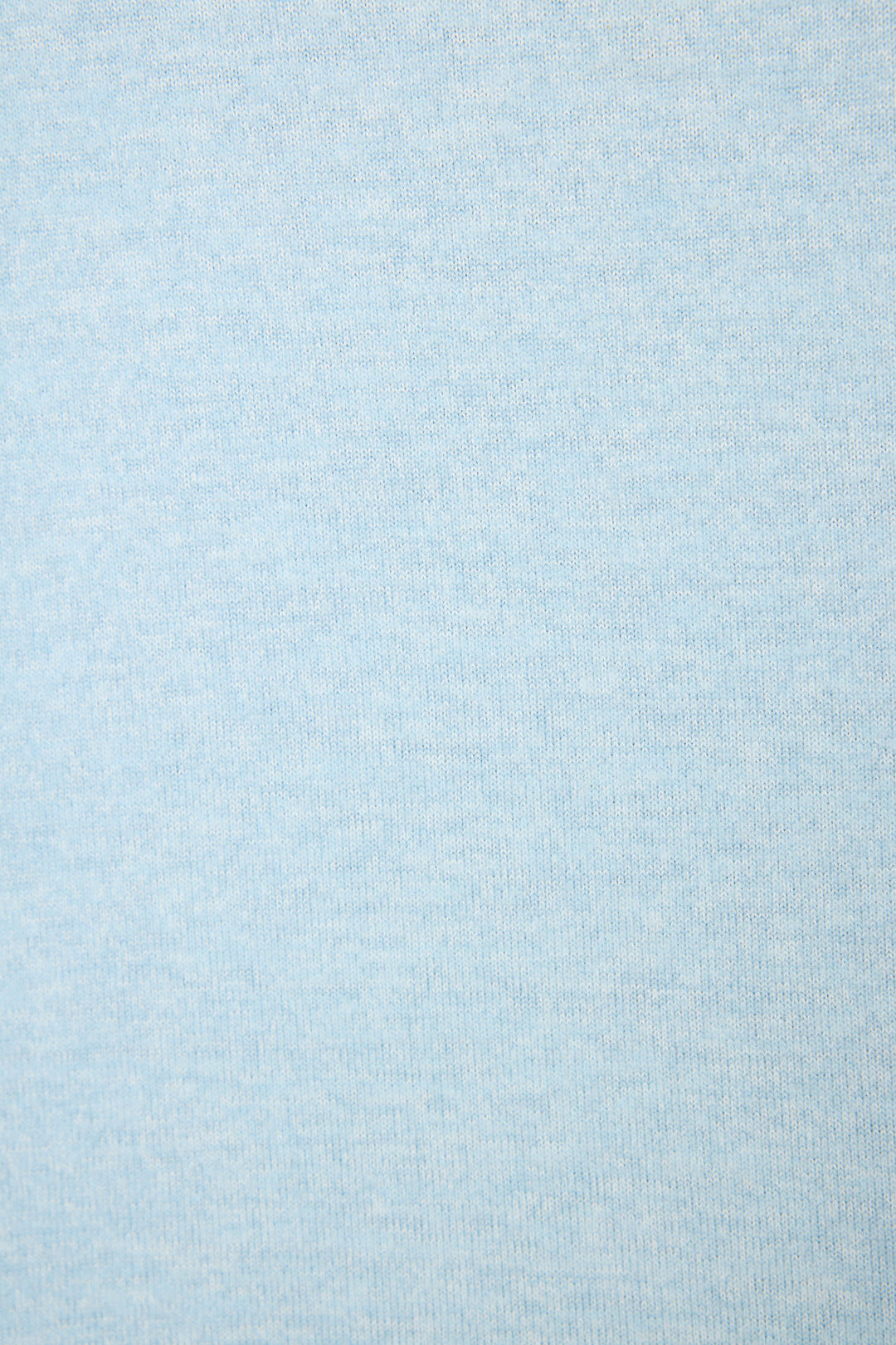 Close-up swatch of light blue melange peachy jersey showing subtle horizontal texture and smooth, softly brushed surface.