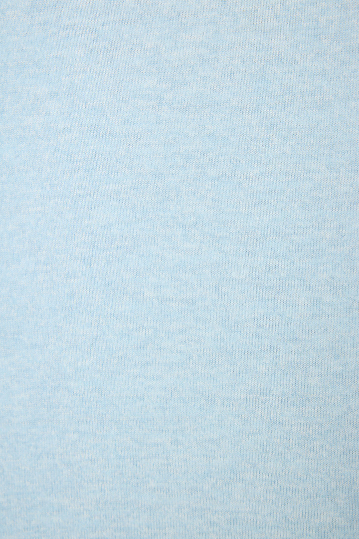 Close-up swatch of light blue melange peachy jersey showing subtle horizontal texture and smooth, softly brushed surface.