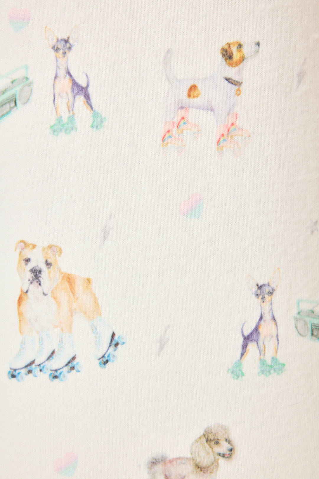Women's ivory pajama pant with dogs on rollerskates pattern. Relaxed fit with banded bottom.